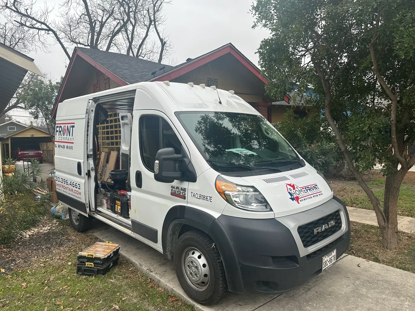 HomeFront Heating & Air service van on a residential call in New Braunfels, TX